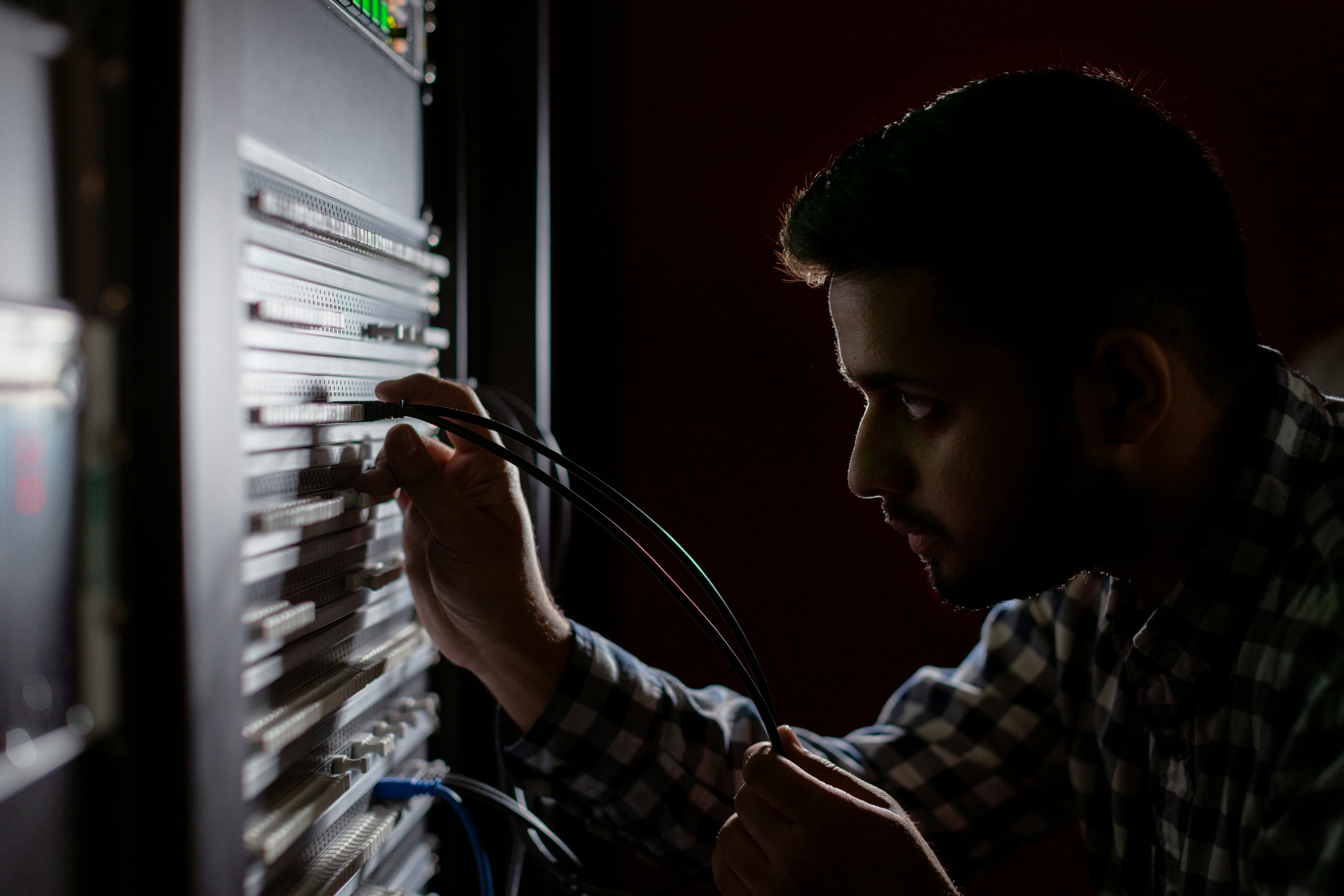 Engineer focused on a hardware diagnostic at a lab bench